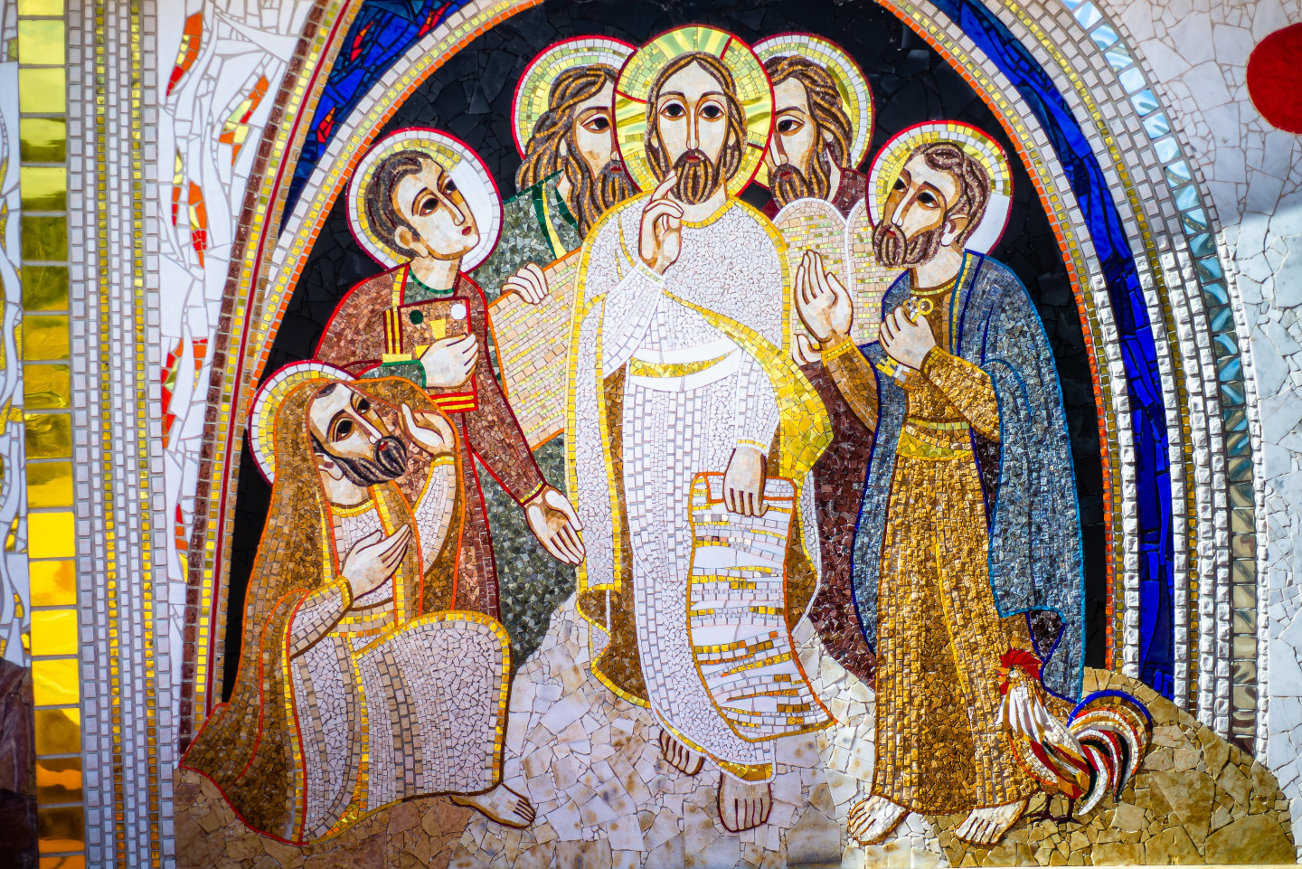 stained glass mural of Jesus surrounded by saints